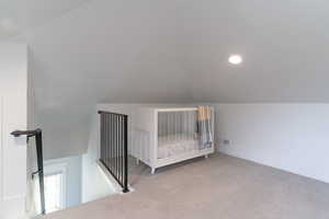 Bonus room featuring lofted ceiling, carpet, and recessed lighting