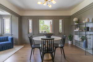 Dining room with a chandelier and wood finished floors