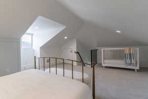 Bedroom featuring lofted ceiling, carpet floors, recessed lighting, and baseboards