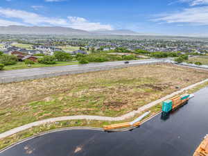 Aerial perspective of suburban area featuring a mountain backdrop