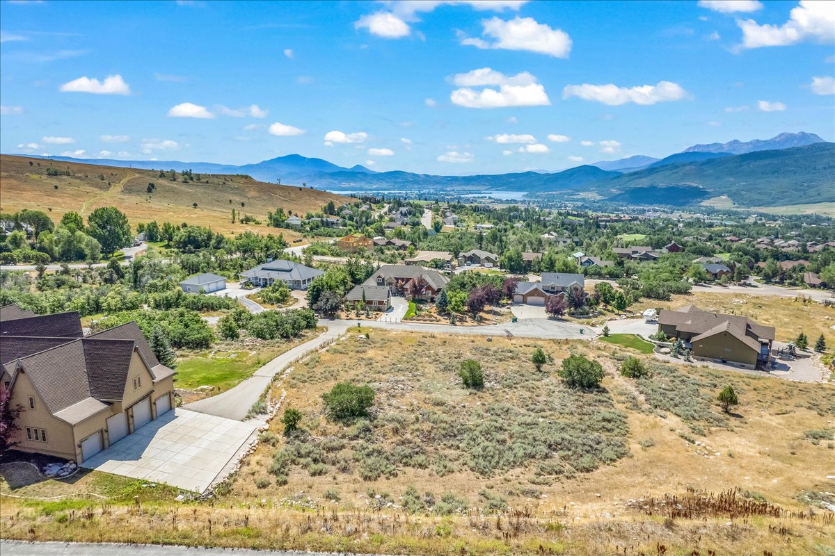 Aerial view of residential area featuring a mountain backdrop