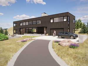 View of building exterior featuring driveway