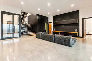 Basement walk out living/entertaining area off of pool