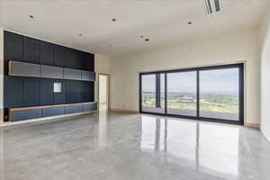 Basement living area with walkout to patio and pool