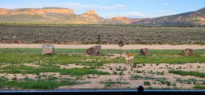View of mountain background featuring rural landscape