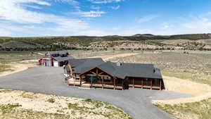 Aerial view of sparsely populated area featuring a desert landscape and mountains