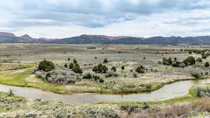 Mountain view with rural landscape and a large body of water