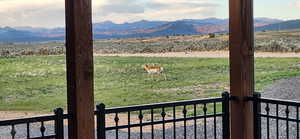 View of mountain backdrop with rural landscape