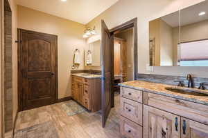Master Bathroom featuring two vanities and recessed lighting