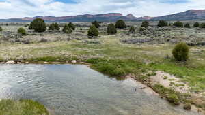 Mountain view featuring a large body of water