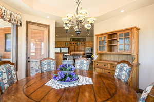 Dining space featuring a chandelier and recessed lighting