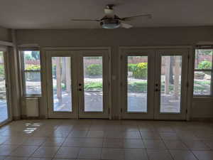 Entryway featuring french doors and healthy amount of natural light