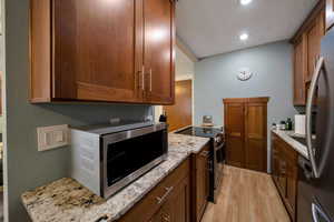 Microwave and cherry cabinets