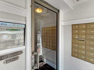 View of property's community with mail area and security door access.