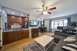 Mounted TV and entertainment center, coffee table and couch allow you to enjoy some R&R.