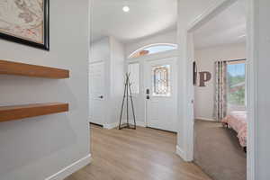 Entrance foyer featuring light wood finished floors and baseboards