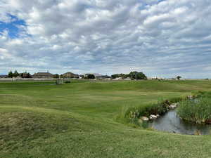 View of community featuring a lawn