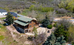 View of subject property featuring a forest