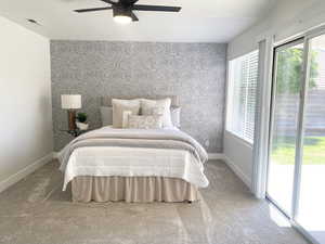 Bedroom with wallpapered walls, access to exterior, baseboards, carpet flooring, and ceiling fan