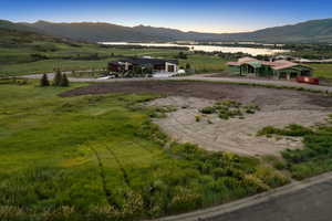 View of mountain backdrop with rural landscape