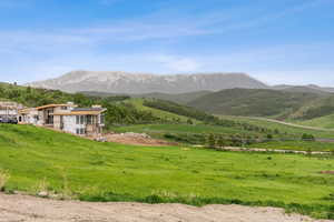 View of mountain background featuring rural landscape