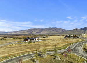 Prime Trappers Crossing lot—1.11 acres with panoramic views and paved access. Peaceful setting near skiing and Pineview Reservoir.