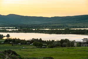 View of mountain backdrop with a nearby body of water