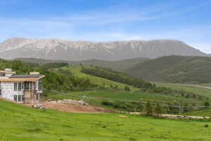 View of mountain backdrop with rural landscape