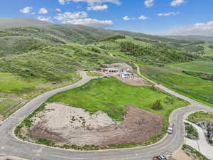 Aerial overview of property's location with a mountainous background