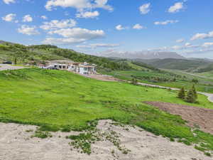 View of mountain backdrop featuring rural landscape
