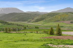 View of mountain background featuring rural landscape
