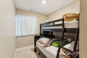 Roper Pole Barn | Conditioned Use |Carpeted bedroom featuring baseboards