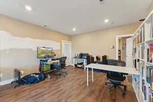 Roper Pole Barn | Conditioned Use |Home office with wood finished floors, recessed lighting, and baseboards