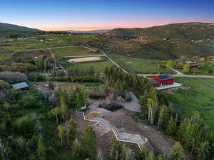 Aerial view of property and surrounding area with rural landscape and mountains 12.48-Acre Horse Property with Barn, Views & Utilities – Build-Ready Lot in Silver Creek Estates, Park City, UT
