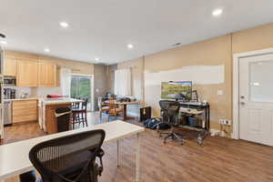 Roper Pole Barn | Conditioned Use | Kitchen with light brown cabinetry, appliances with stainless steel finishes, a desk, light countertops, and recessed lighting