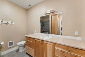 Roper Pole Barn | Conditioned Use |Bathroom with heating unit, toilet, vanity, a shower, and baseboards