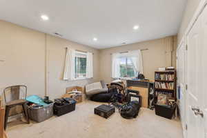 Roper Pole Barn | Conditioned Use |Sitting room with carpet floors and recessed lighting