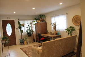 Living area featuring plenty of natural light and recessed lighting