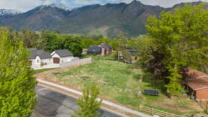 Aerial view of residential area featuring a mountainous background