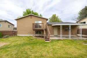 Back of property with a patio area and stairway