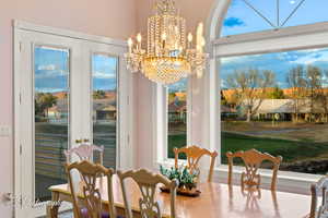 Dining room with a chandelier and plenty of natural light