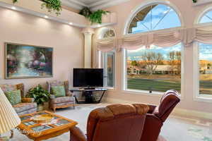 Living room featuring ornamental molding, baseboards, and recessed lighting