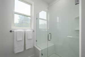 Full bathroom with a shower stall