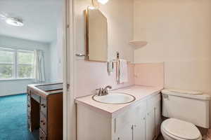 Bathroom with vanity and toilet