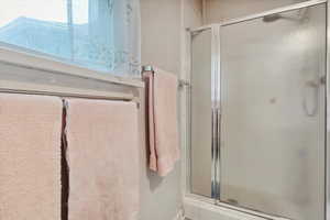 Bathroom featuring a shower stall