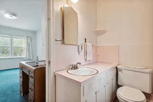 Bathroom with vanity and toilet