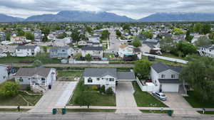 Aerial perspective of suburban area with a mountain backdrop
