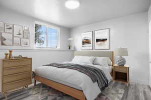 Third bedroom with LVP wood look floors and baseboards