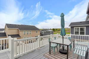 Deck with outdoor dining area and a view of the golf course. Great for watching the air shows.