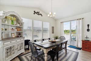Dining room featuring vaulted ceiling, great views of the golf course, and entrance to the amazing deck.